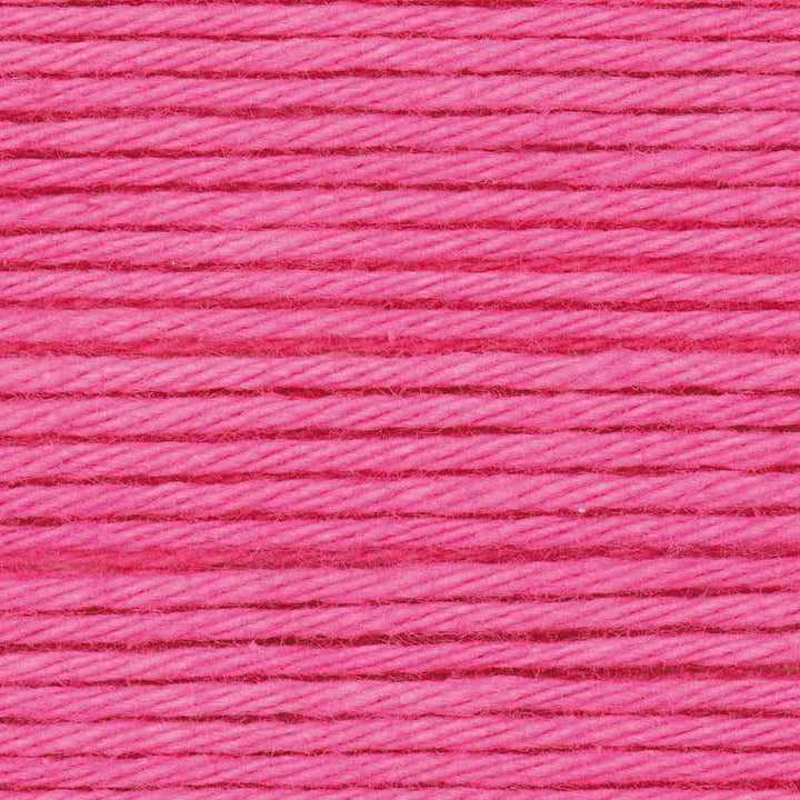 Close-up of pink thread with a textured pattern