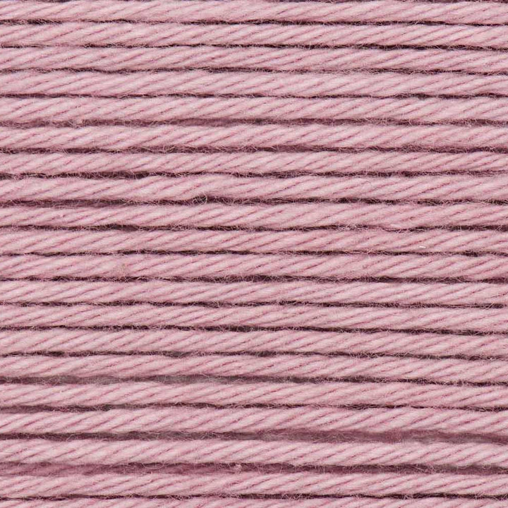 Close-up of pink yarn with a textured pattern