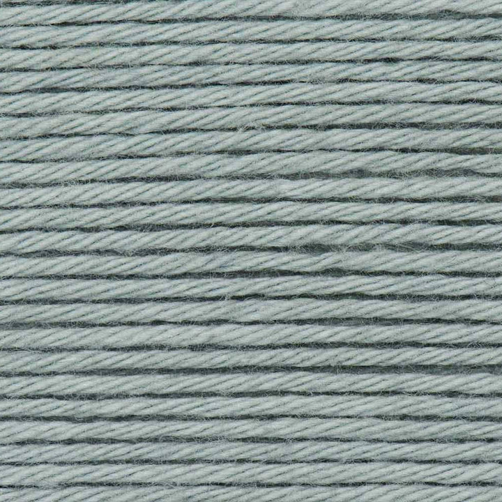 Close-up of light blue yarn with a textured pattern
