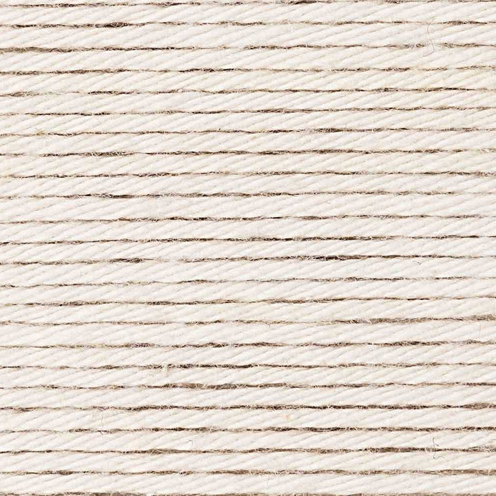 Close-up of a textured beige fabric surface