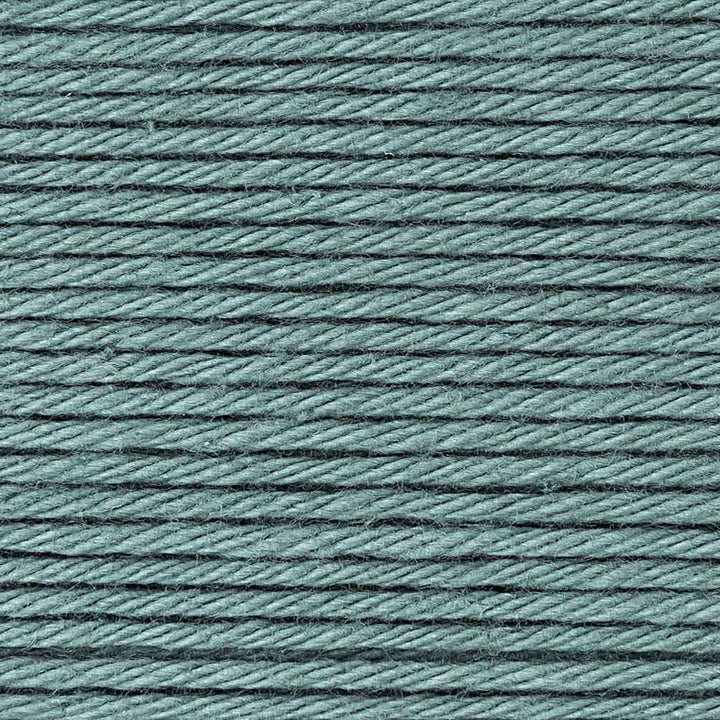Close-up of teal yarn with a textured pattern