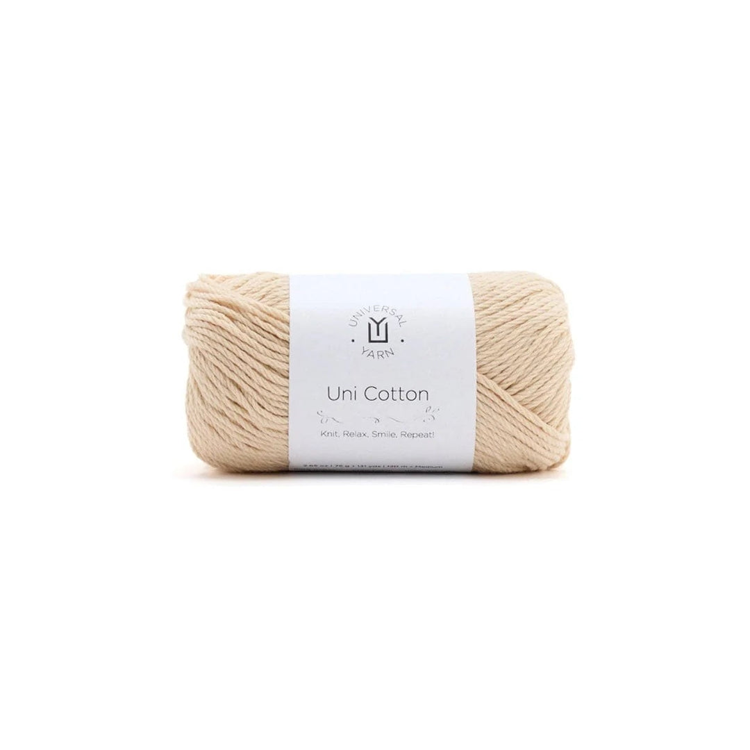 Cream ball of yarn with a label on a white background