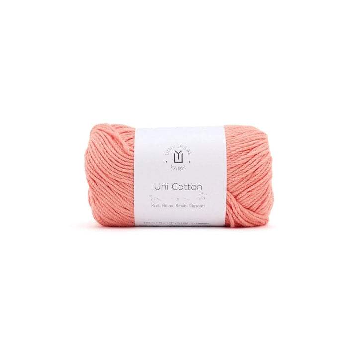 Ball of pink yarn with a label on a white background