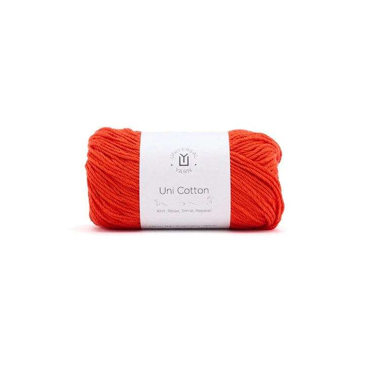 A skein of bright orange-red yarn with a white paper label, centered on a plain white background.