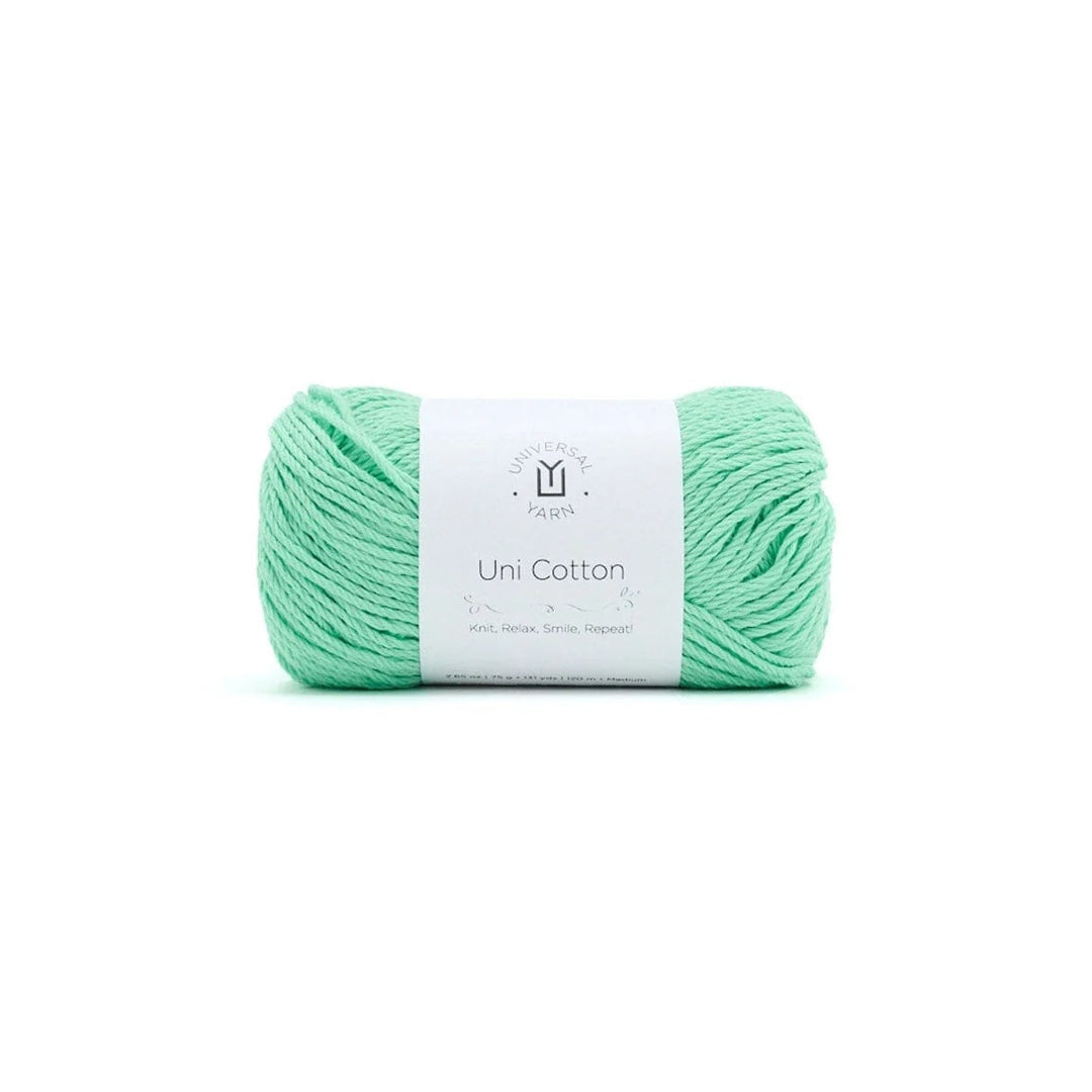 Mint green yarn ball with a label on a white background