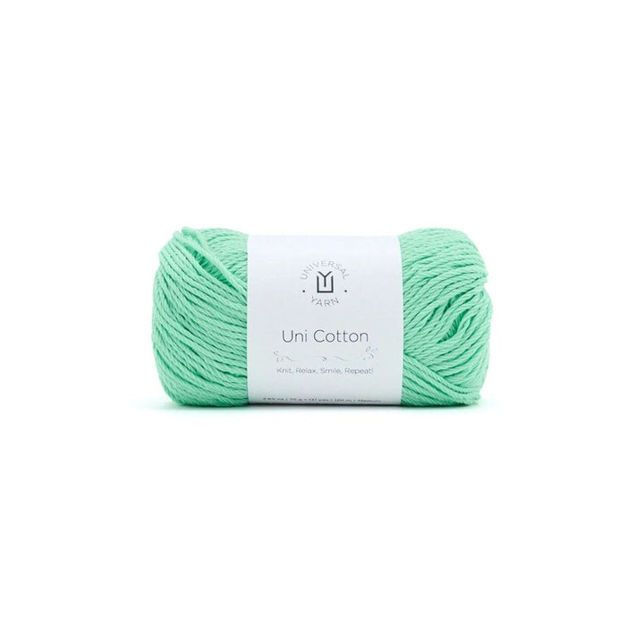 Mint green yarn ball with a label on a white background