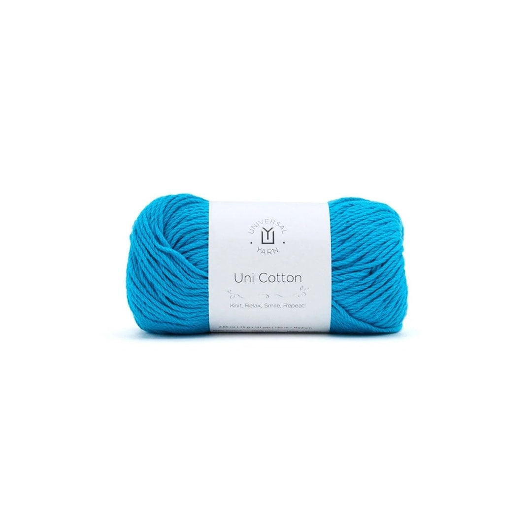 Blue skein of yarn with a white label on a white background