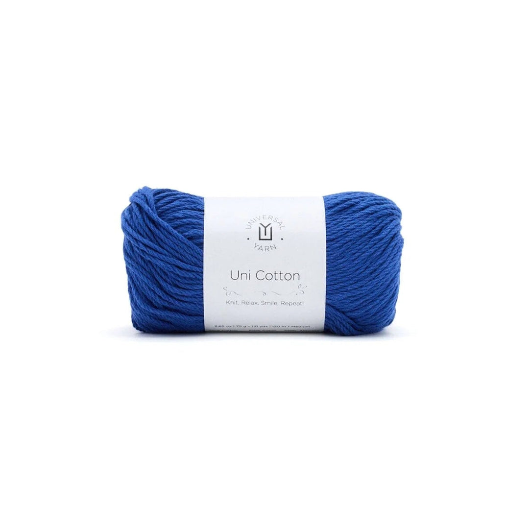 Blue skein of yarn with a white label on a white background
