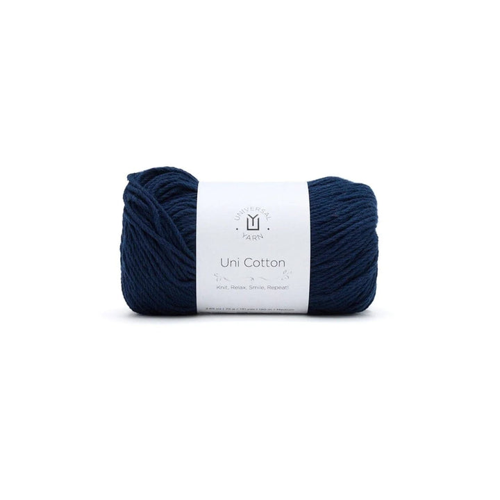 Navy blue yarn ball with a white label on a white background
