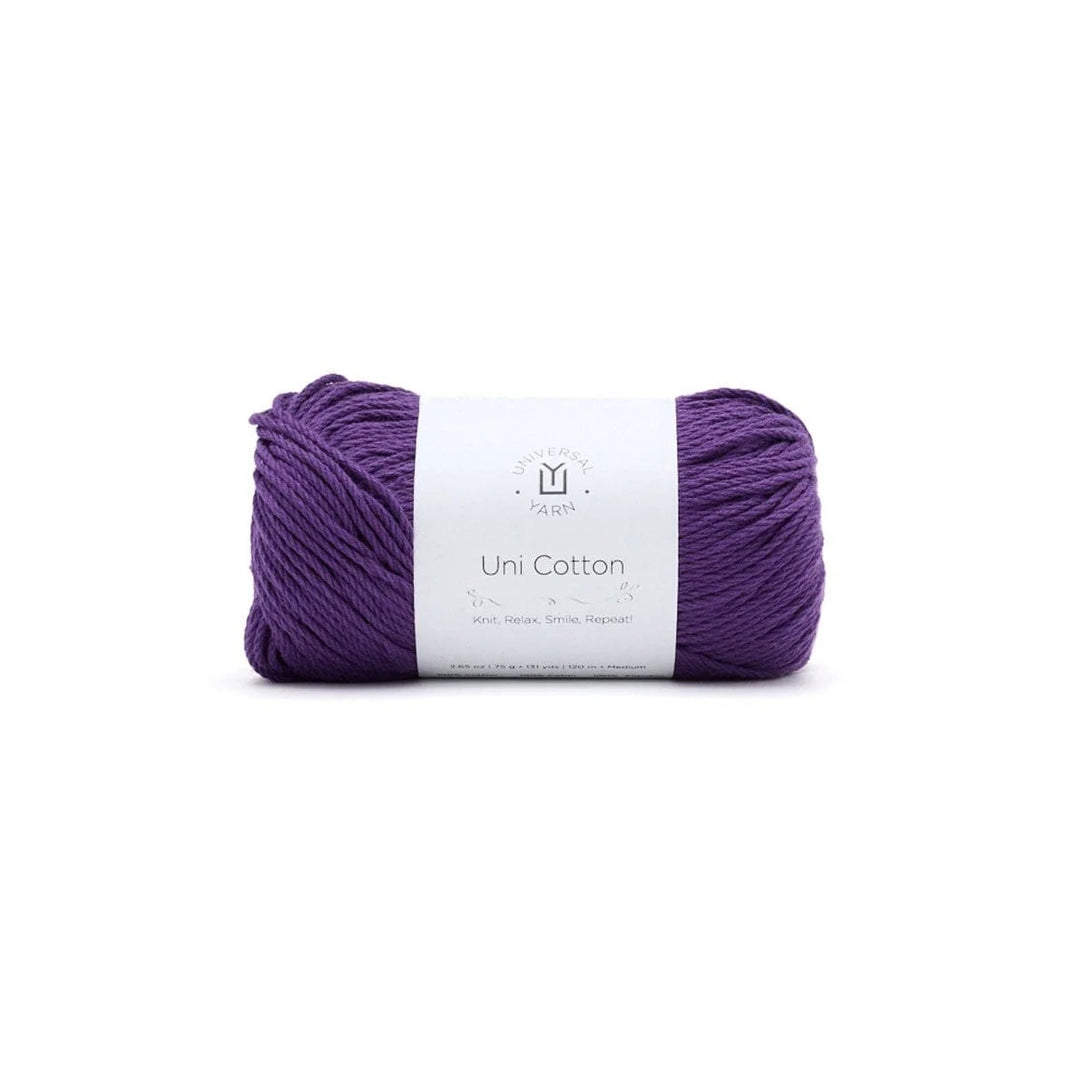 A skein of purple yarn with a white paper label reading 'Uni Cotton' and a small logo above it, centered on a plain white background.