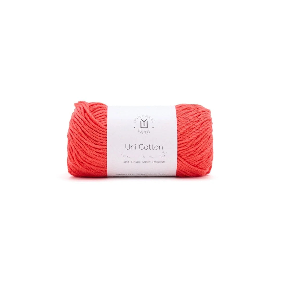 A skein of coral-pink yarn wrapped with a white paper label that reads 'Uni Cotton' and a small 'M' logo, centered on a plain white background.