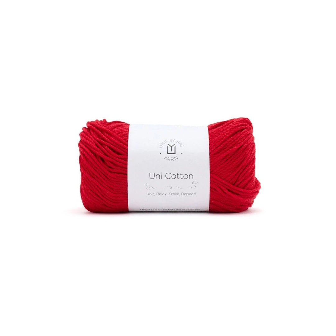 Red yarn ball with a white label on a white background