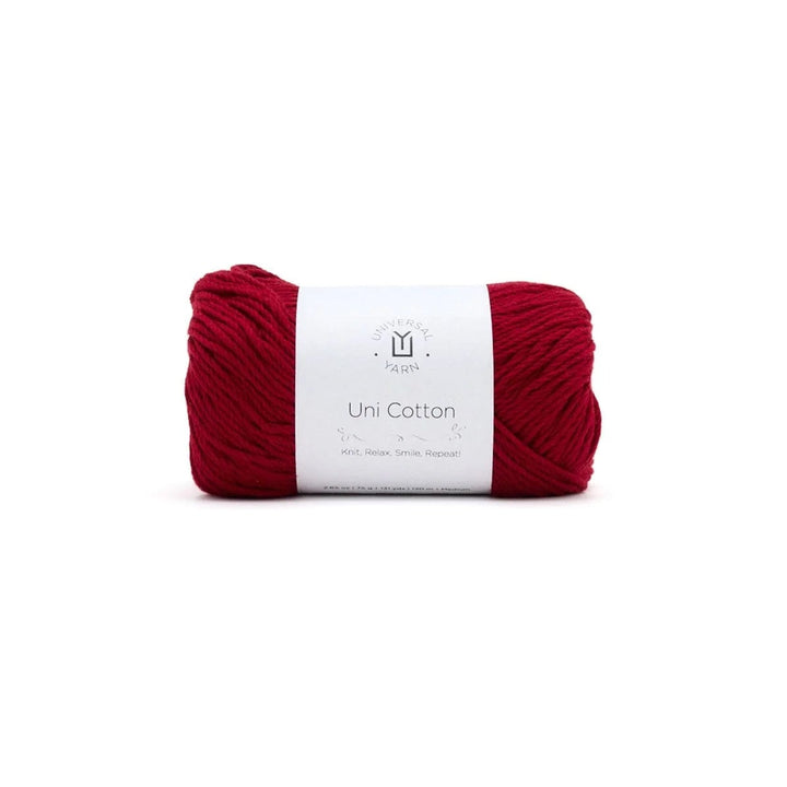 Red yarn ball with a label on a white background