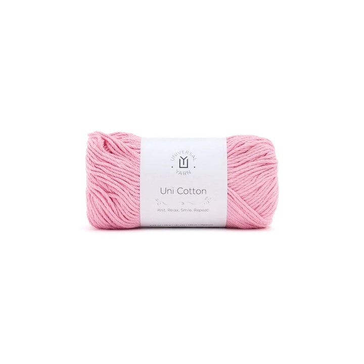 A skein of light pink yarn with a white paper label wrapped around it, centered on a plain white background.