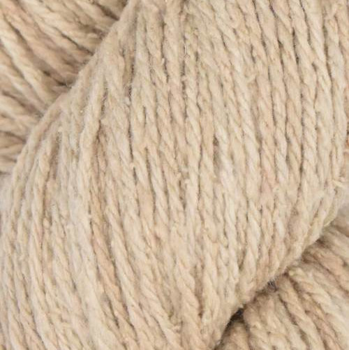 Close-up of beige yarn with a textured surface