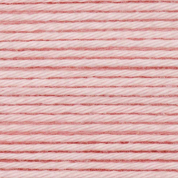 Close-up of pink and white yarn strands